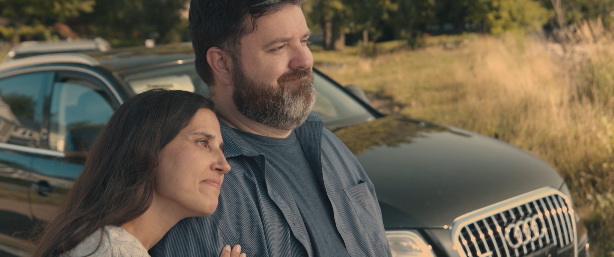A frame from a Conteur Studios cinematic brand film, a couple at golden hour